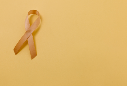 A gold ribbon on yellow background