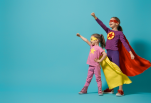 Two kids dressed as superheroes