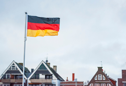 Picture of a cloudy sky and a German flag
