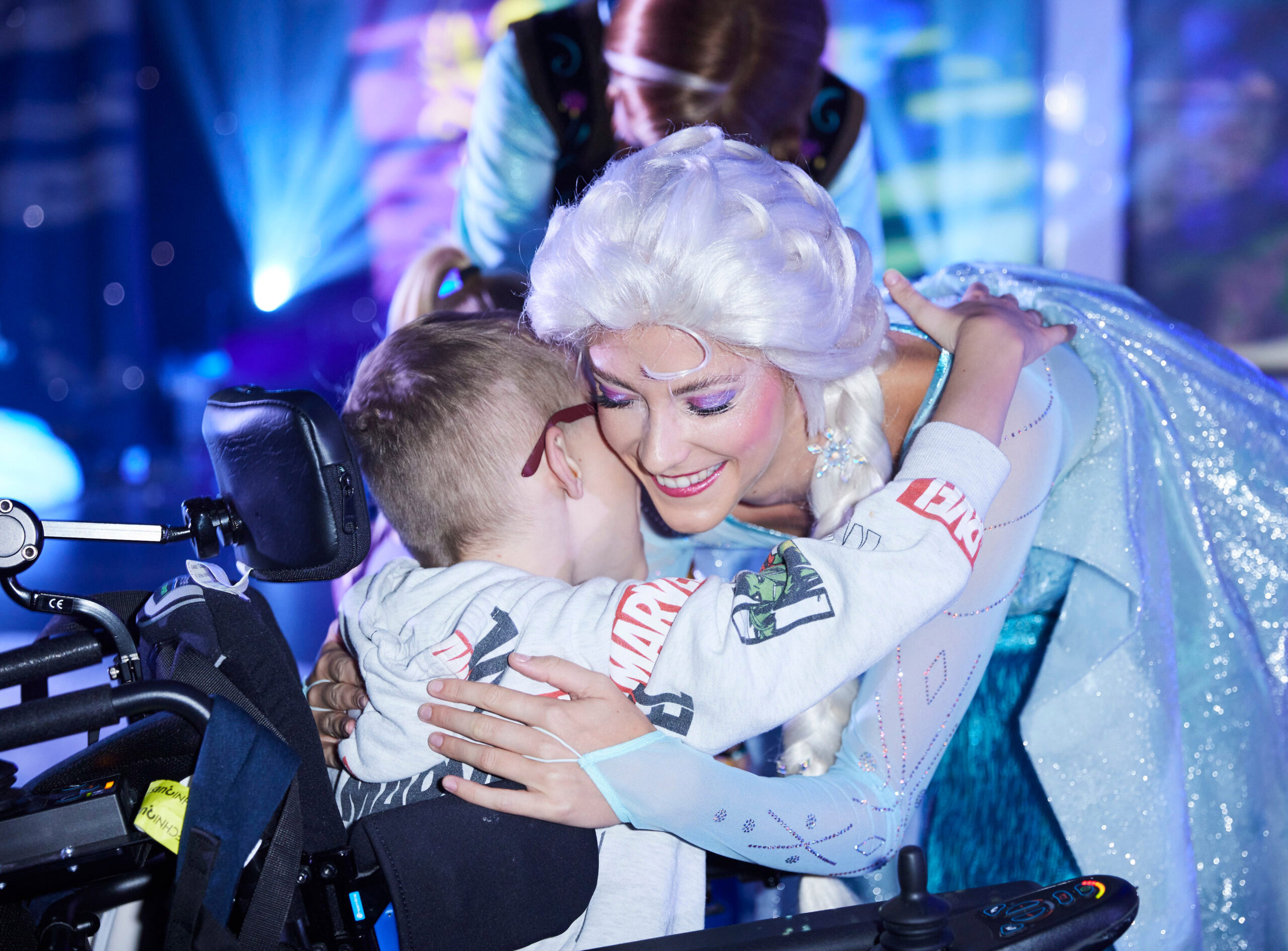 Elsa hugs a wish child