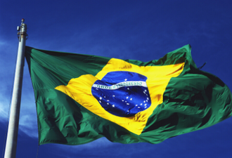 Picture of a blue sky with a Brazilian flag