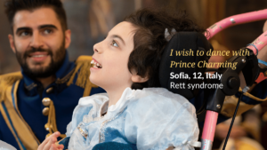 Wish child Sofia looks up hopefully in front of Prince Charming