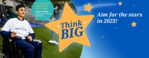 A banner entitled "Think Big" with a blue starry background and a young man in a wheelchair