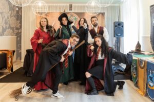 A group of teachers wearing Harry Potter costumes in a classroom