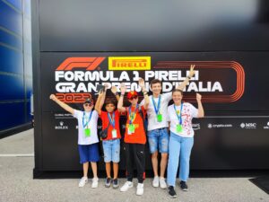 A group of wish children at a Formula 1 Grand Prix