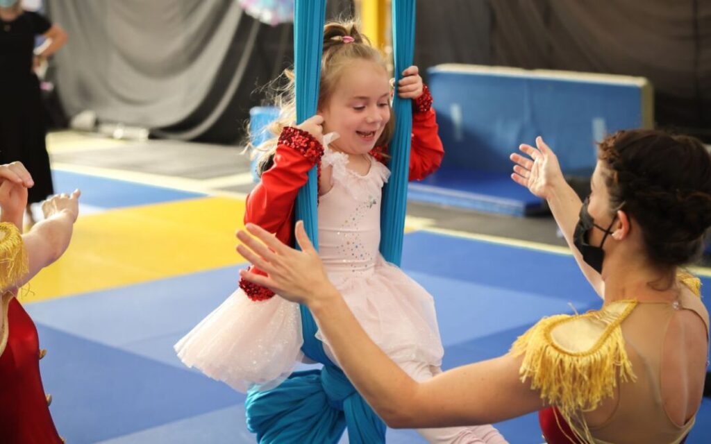 A child swings on ropes