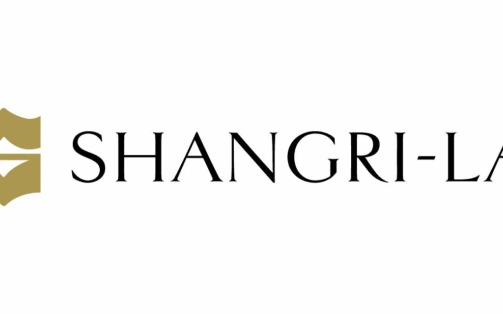 Gold abstract emblem on the left, followed by the text SHANGRI-LA in elegant, black uppercase letters on a white background.