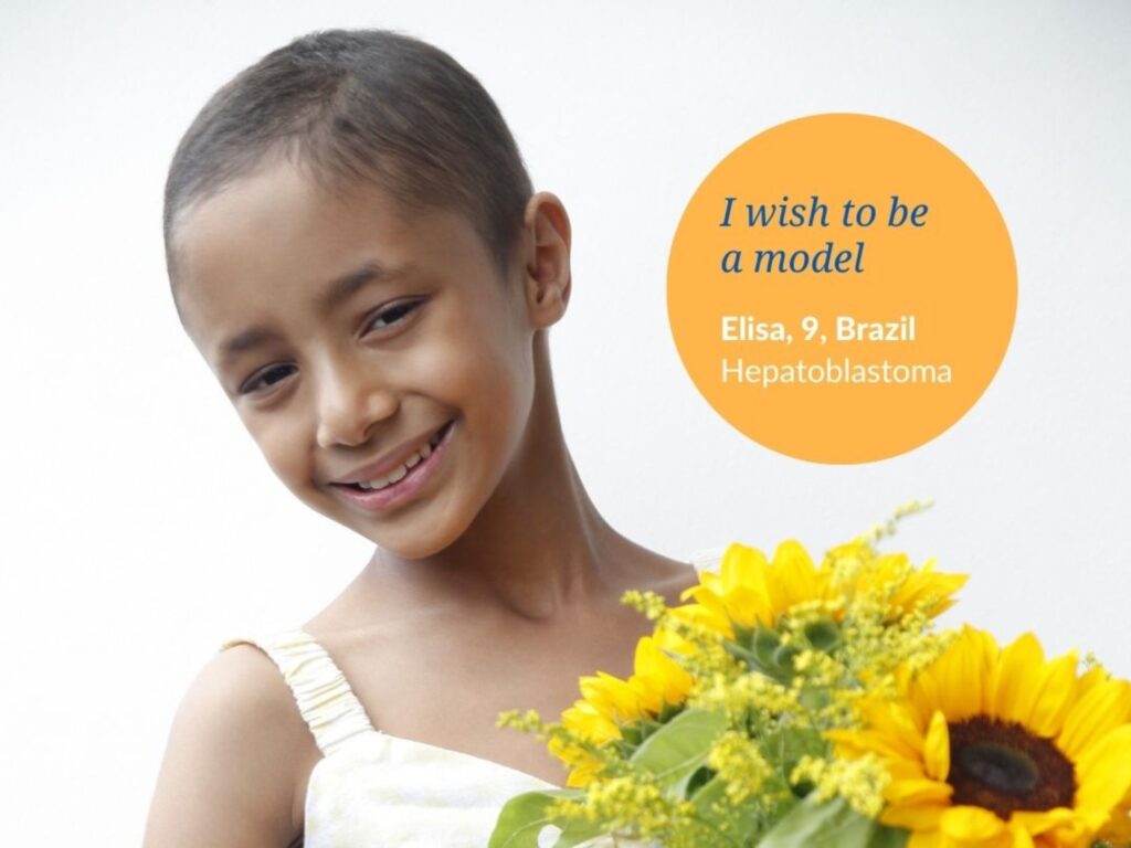 A young girl with short hair smiles while holding a bouquet of sunflowers. Text reads: Elisas wish to be a model. Elisa, 9, Brazil. Hepatoblastoma.