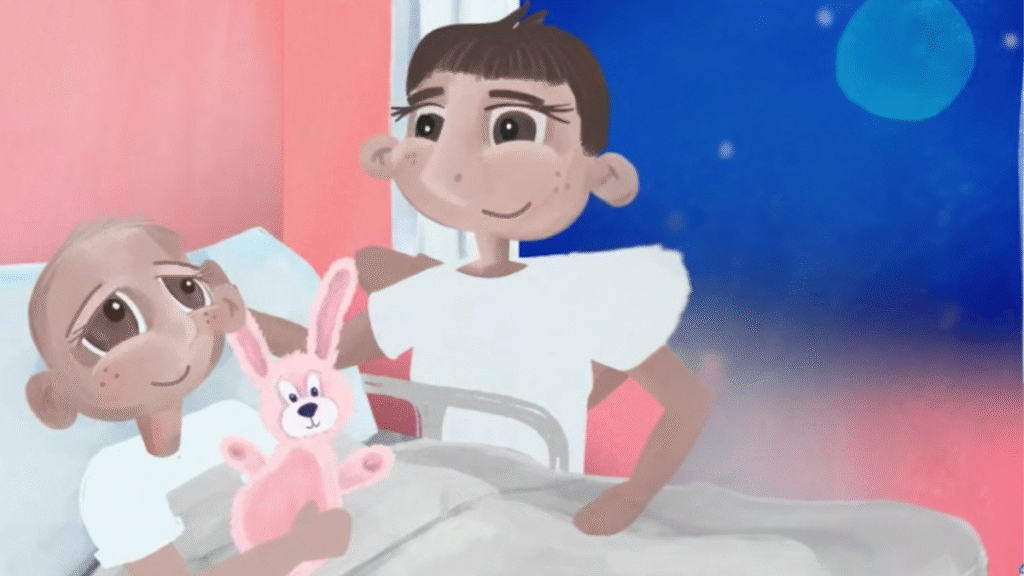 Two children with short hair are in a hospital room at night. One child is lying in bed holding a pink stuffed bunny, while the other stands beside the bed, smiling at them. The window shows a night sky with a full moon.