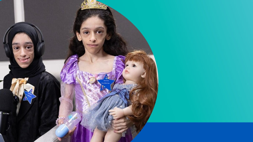 Two children stand together. One wears a black outfit and headset, the other wears a purple princess dress, tiara, and holds a doll. Both have star-shaped name tags. The background features a teal gradient.
