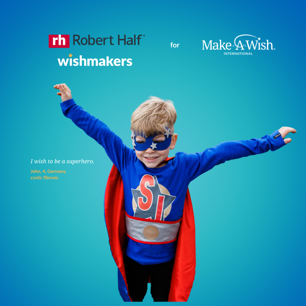 A young boy in a blue superhero costume and star mask smiles with arms outstretched. Text reads “I wish to be a superhero. John A., Germany, cystic fibrosis.” Robert Half fundraising and Make-A-Wish logos are at the top.