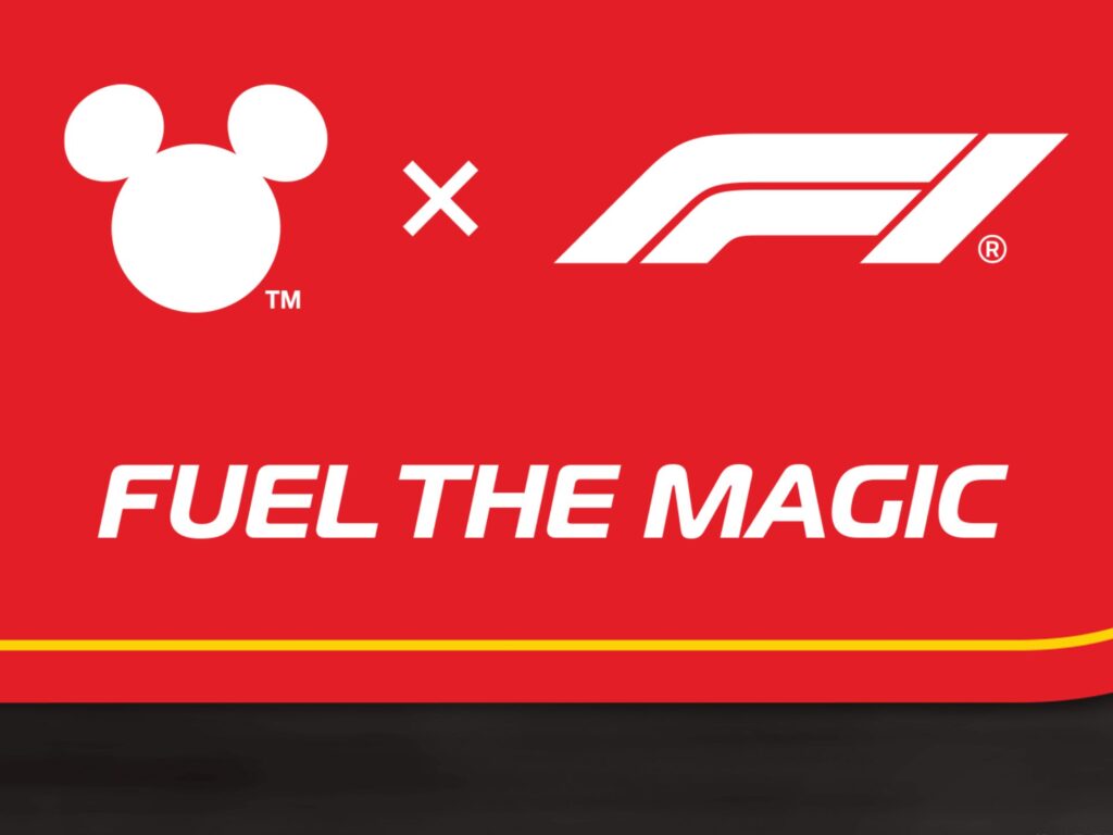 Red background with the Disney Mickey Mouse logo next to the Formula 1 (F1) logo, separated by an x. Below, bold white text reads FUEL THE MAGIC.