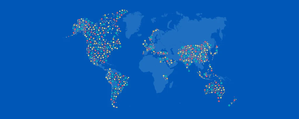 A world map on a blue background where North America, South America, parts of Europe, Asia, and Oceania are filled with small, colourful stars.
